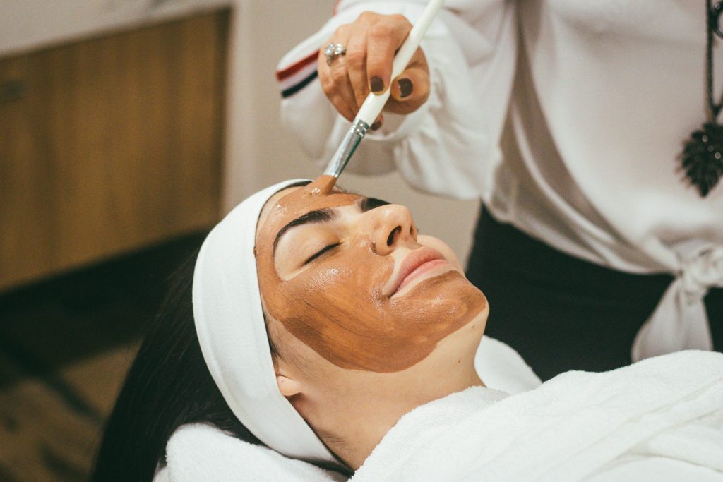 Woman getting facial treatment